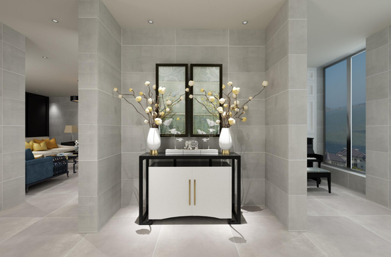 Contemporary living space featuring large format grey floor and wall tiles